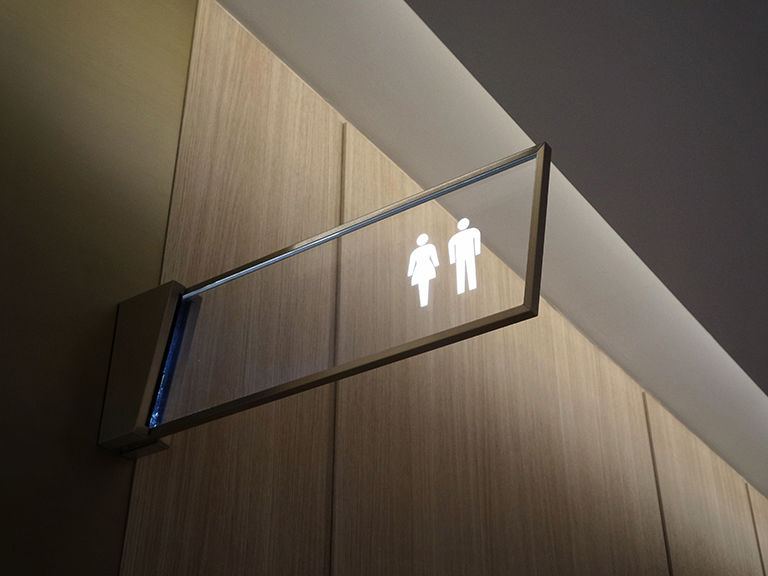 Crystal clear bathroom signs for male & female in Charlotte, NC