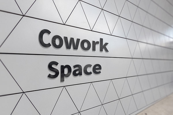 Cowork Space office lobby signs in Charlotte, NC