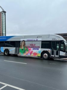 Custom Kelly show graphics on bus by QC Signs & Graphics